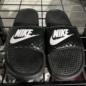 Size 9 Nike slides.